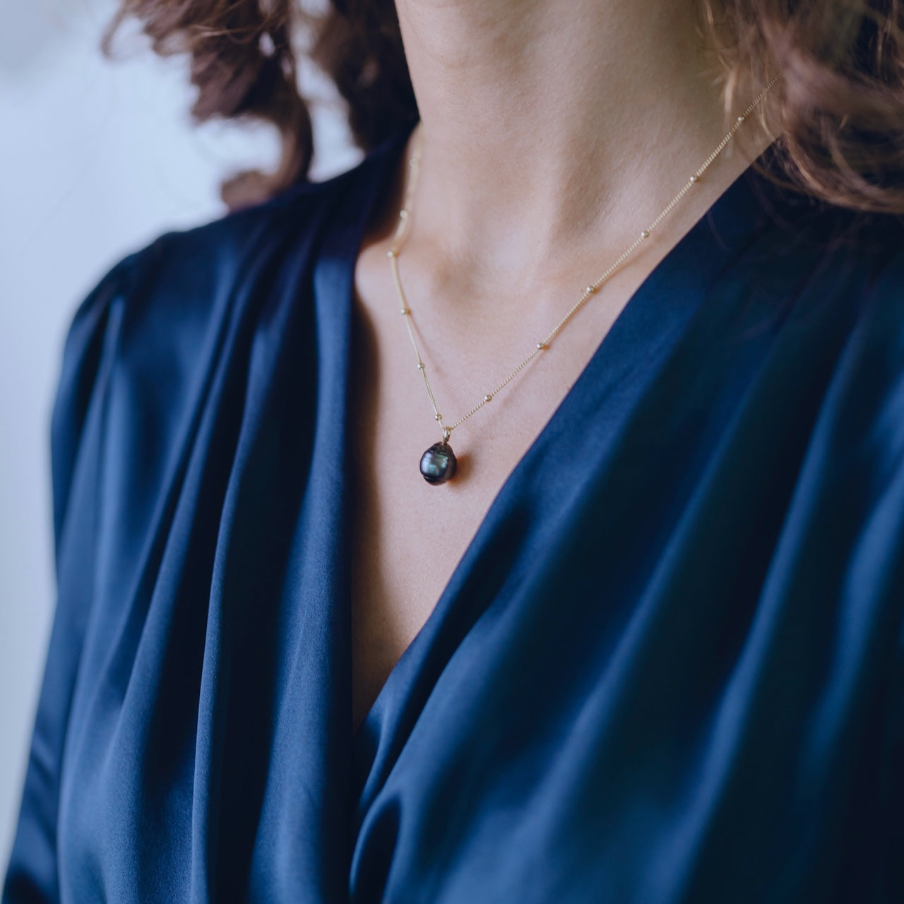 Pearl Obsession Tahitian pearl necklace styled showing dramatic dark pearl elegance