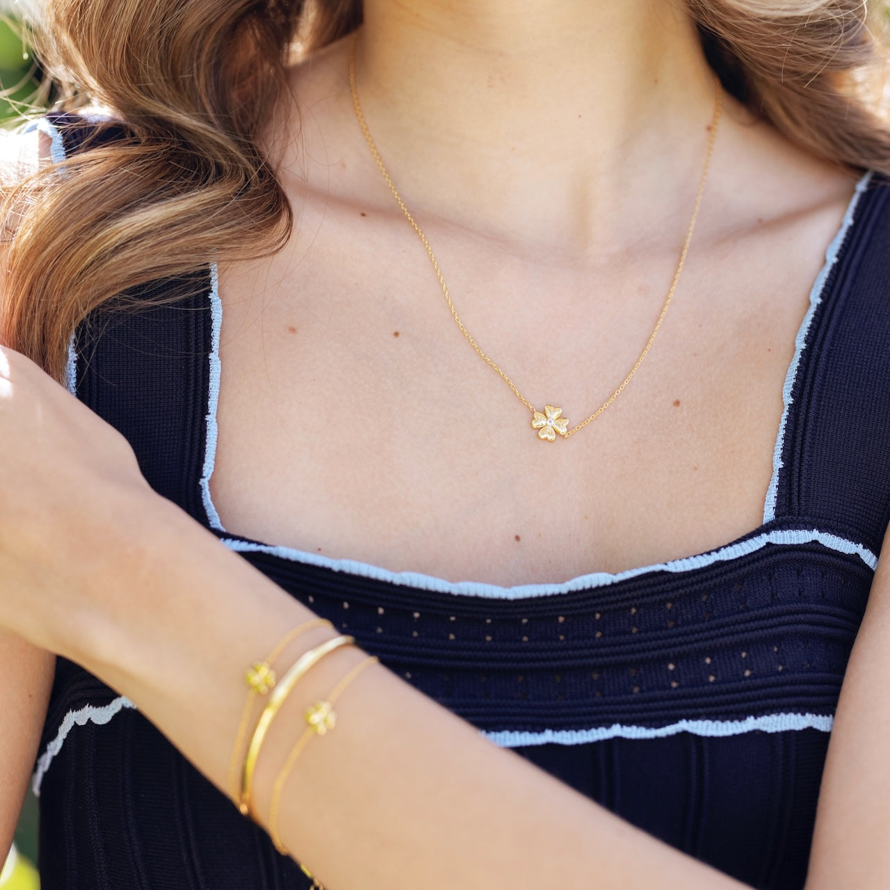 Origins collection clover necklace styled showing lucky charm pendant detail