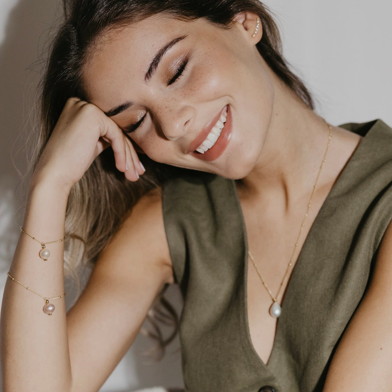 Freshwater pearl bracelet styled showing lustrous pearls and delicate gold accents