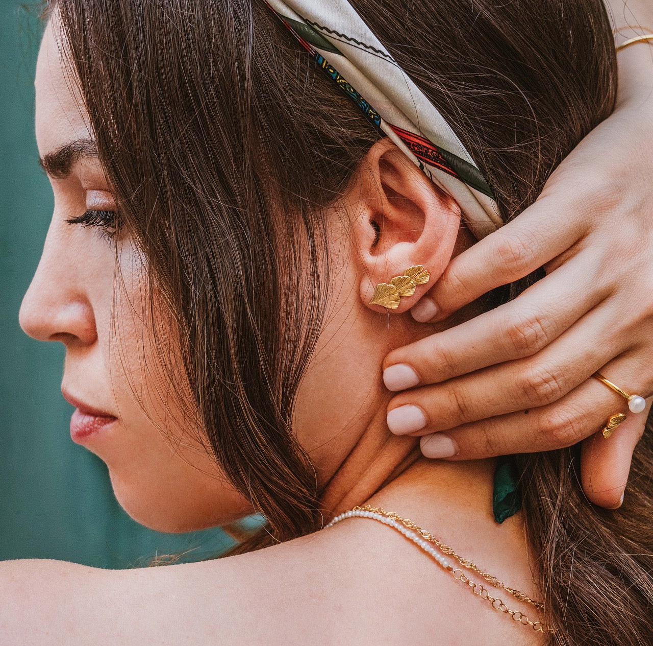 Ginkgo ear climber pair in gold vermeil worn showing cascading effect on both ears