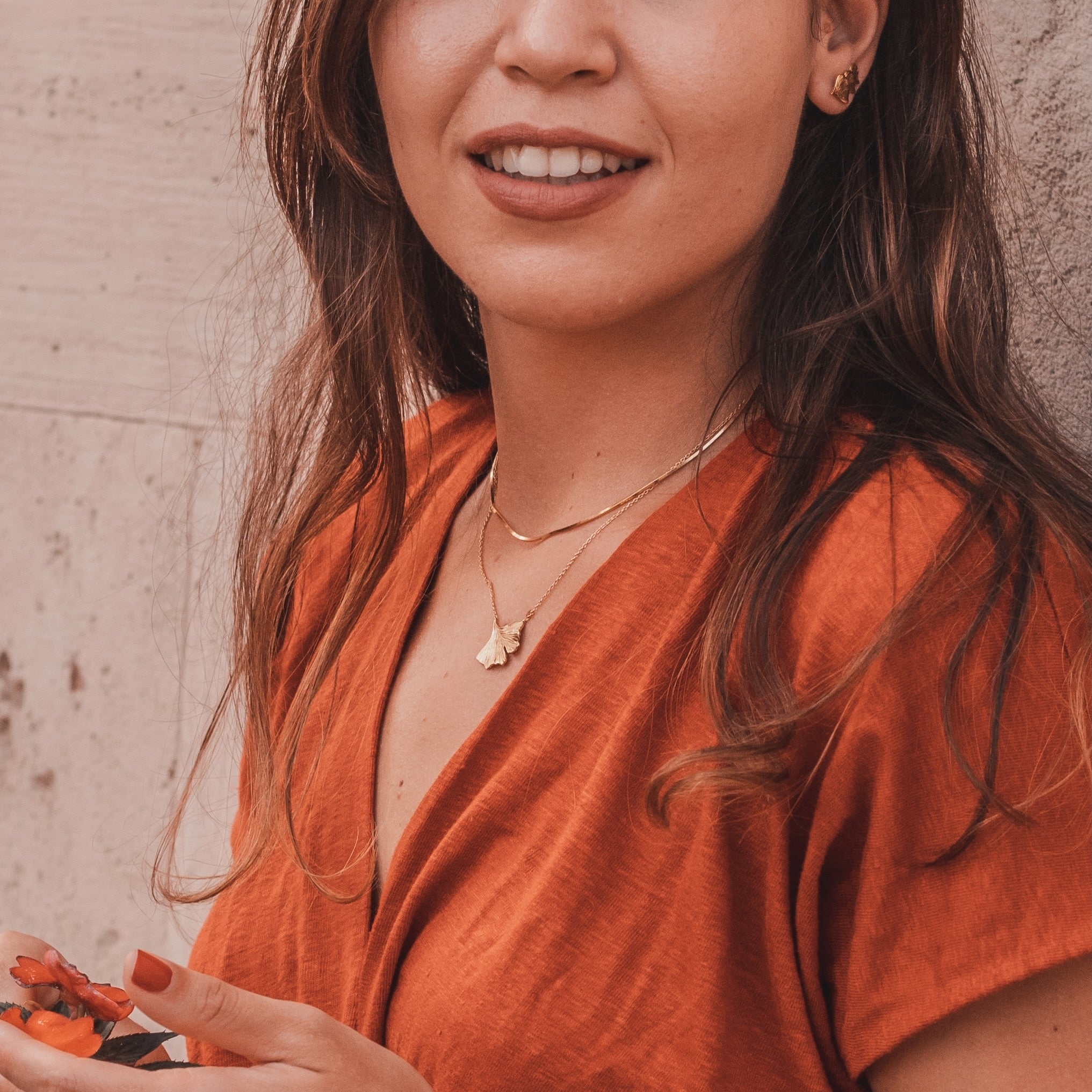 Ginkgo necklace in gold vermeil worn on neck