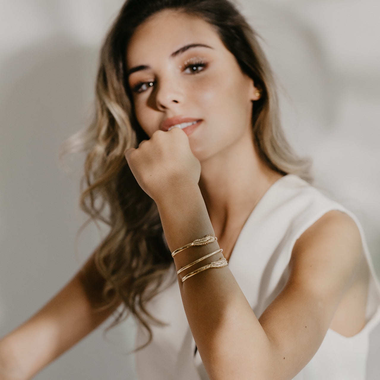 Palm leaf bracelet in gold vermeil worn on wrist