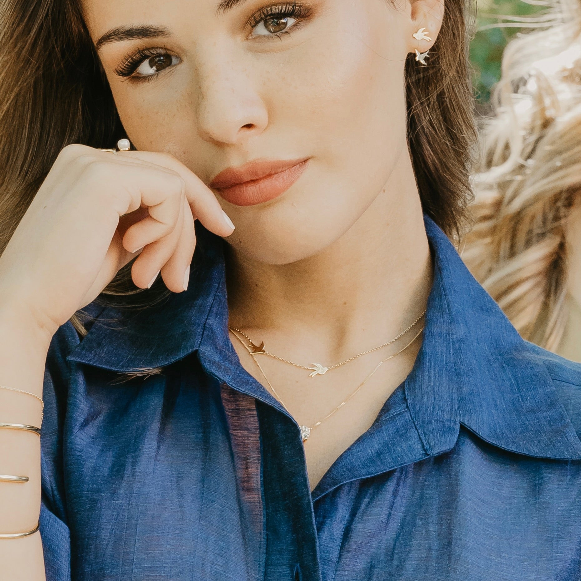 Origins collection swallow necklace styled showing bird pendant symbolizing hope