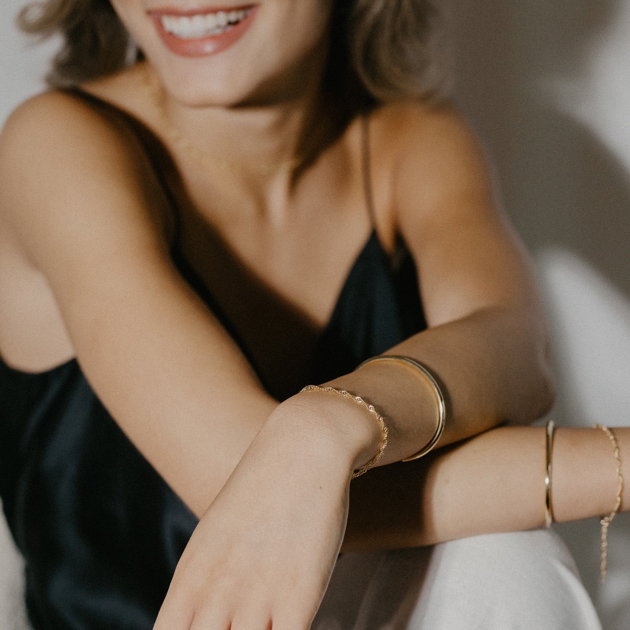 Twisted chain bracelet styled showing delicate chain texture and adjustable fit