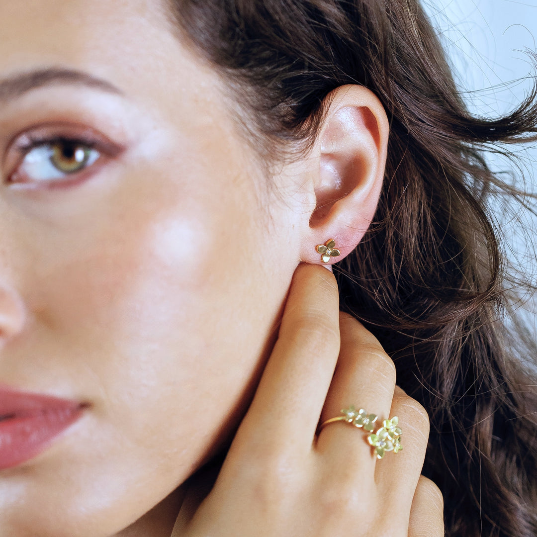 Bloom stud worn showing hydrangea petal design on ear