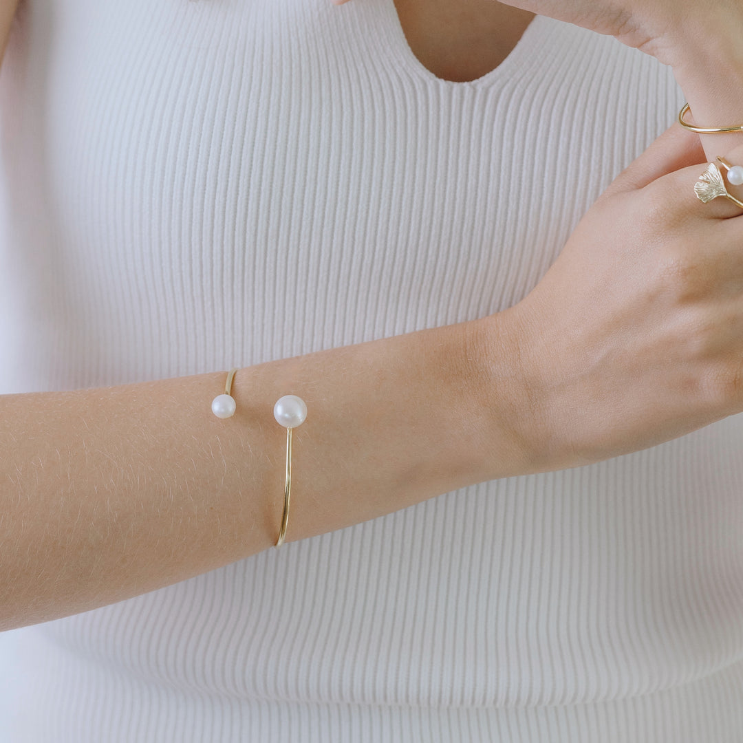 Freshwater pearl cuff bracelet in gold vermeil worn on wrist