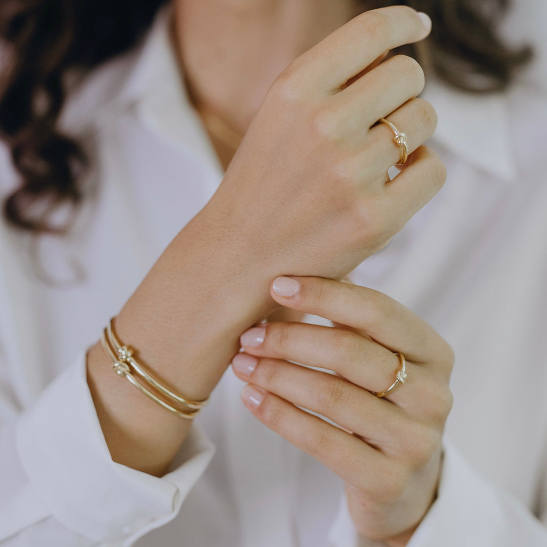 Knot collection ring styled displaying delicate twisted knot texture