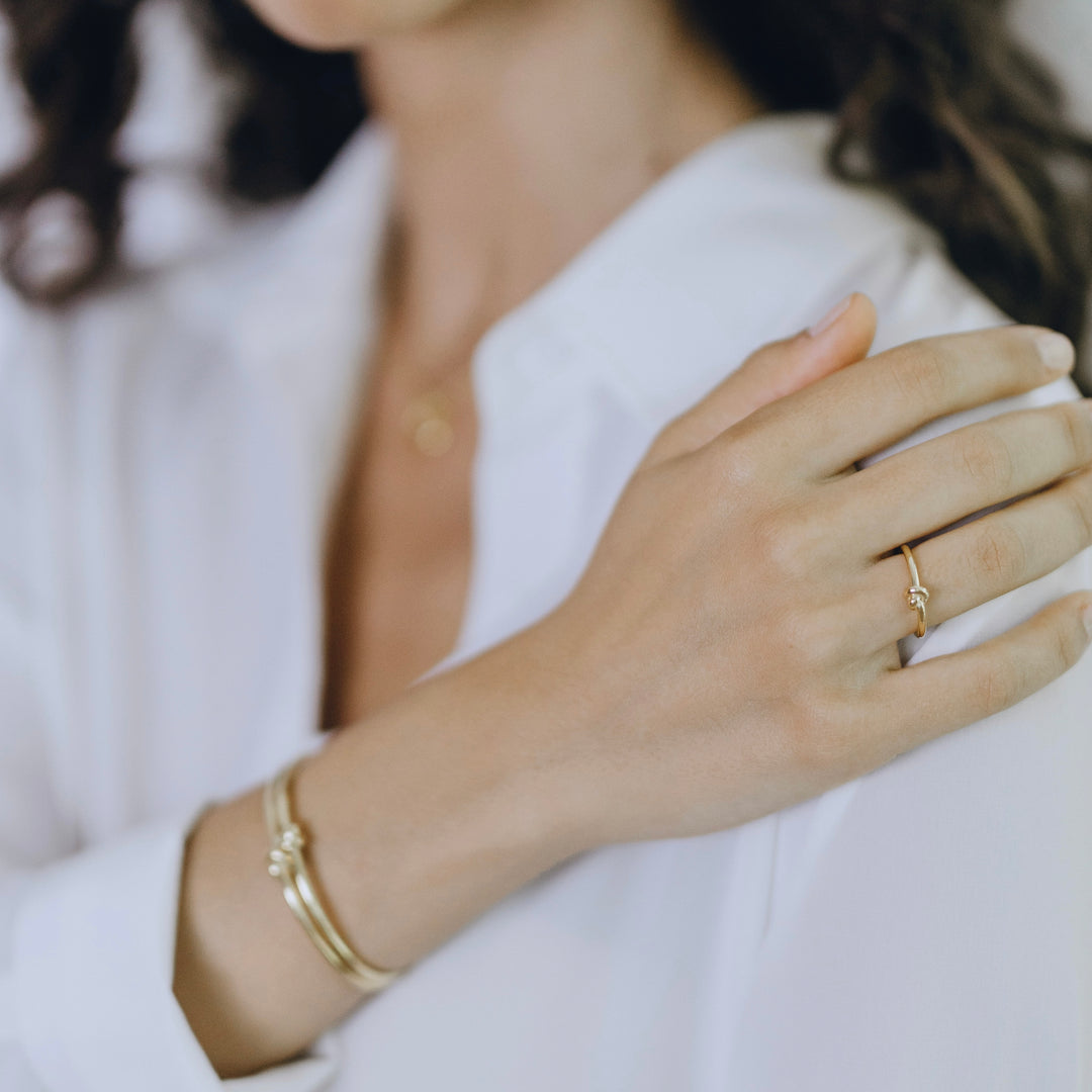 Close-up of Knot ring worn showing organic rope-like circular detail