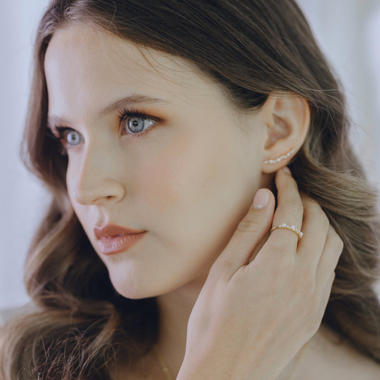 Pearl and white topaz ring in gold vermeil worn on finger