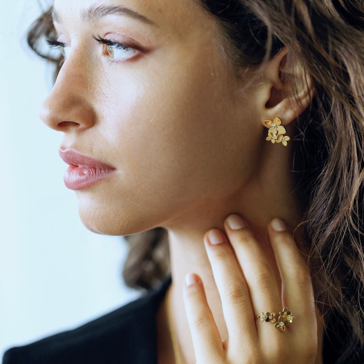 Bloom collection trio earrings styled showing three-flower cascading design