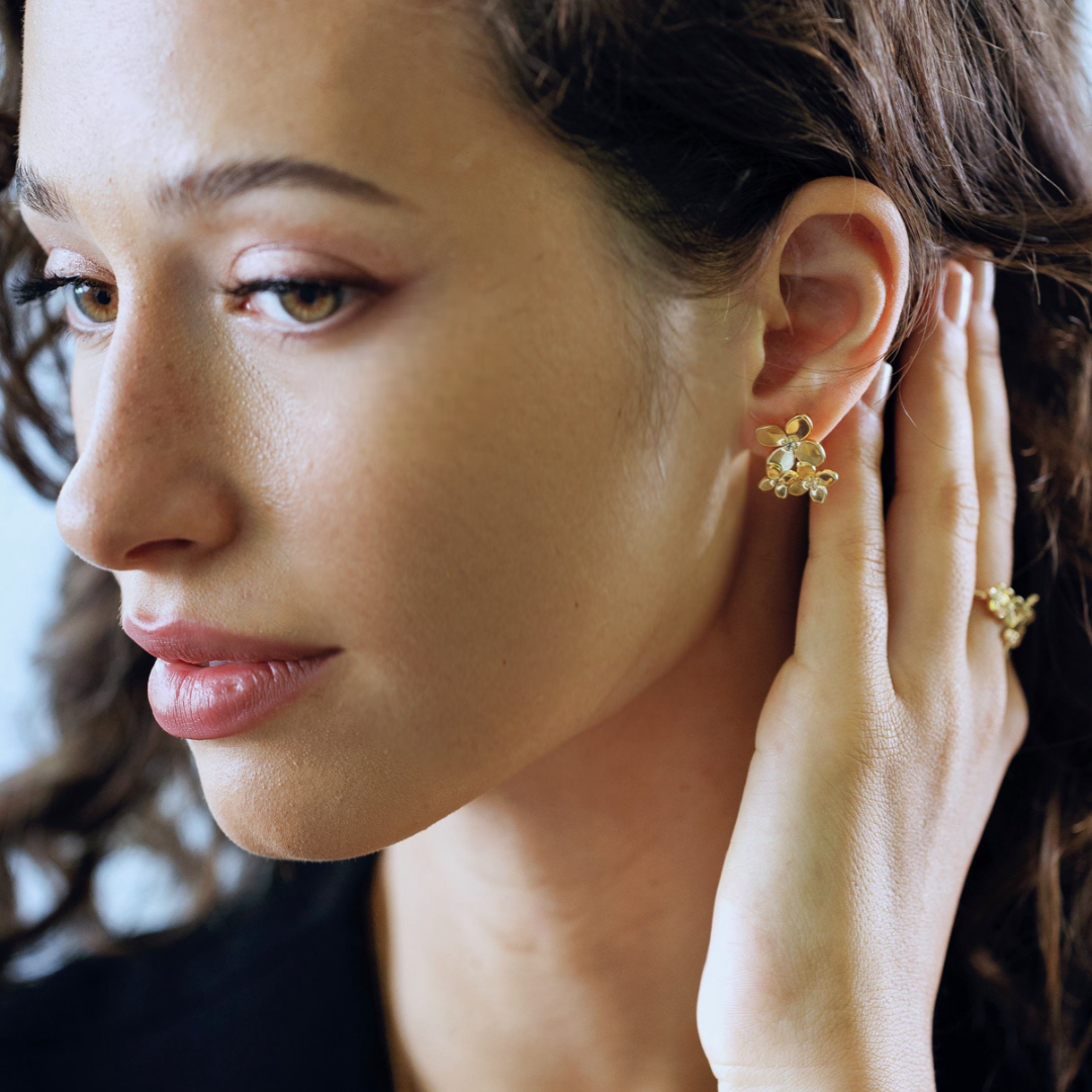 Bloom trio hydrangea earrings in gold vermeil worn on ear