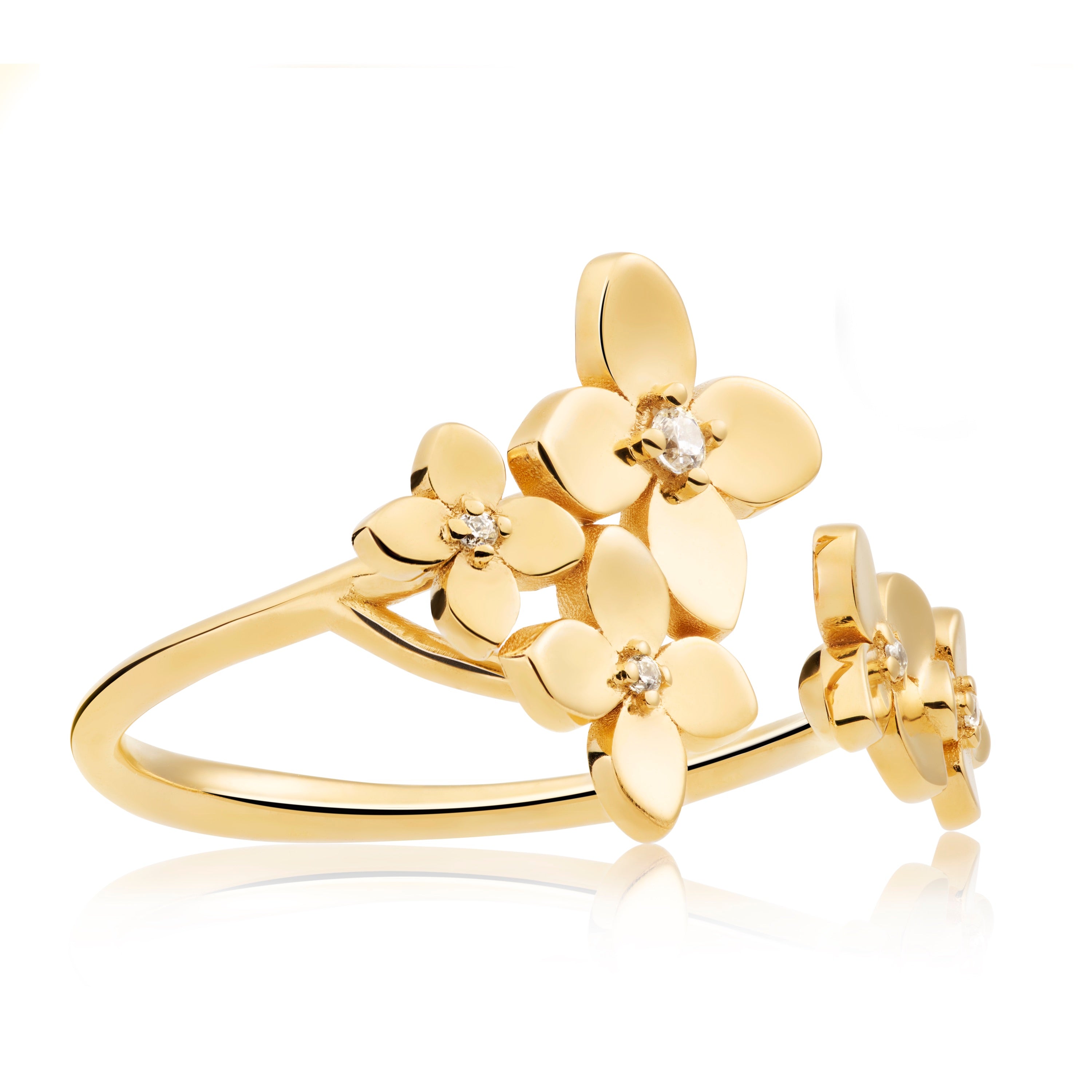 Close-up of Bloom ring showing petal-shaped details and white topaz sparkle