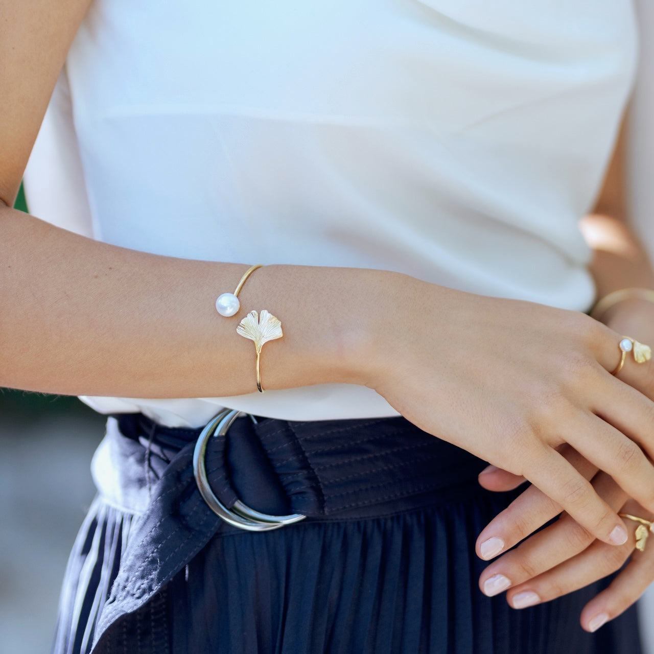 Ginkgo and freshwater pearl bracelet in gold vermeil worn on wrist