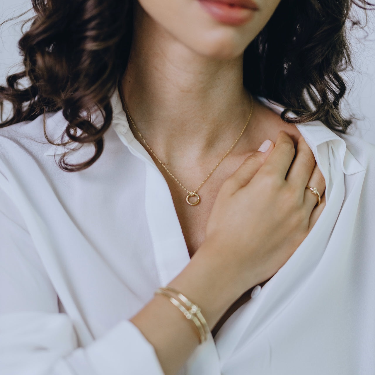 Knot collection circular pendant necklace styled showing delicate rope design