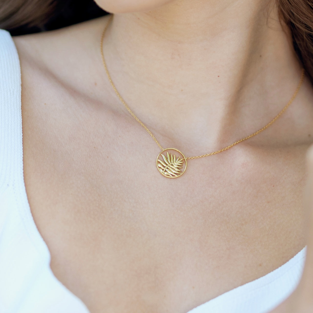 Origins collection palm leaf necklace styled showing botanical pendant detail