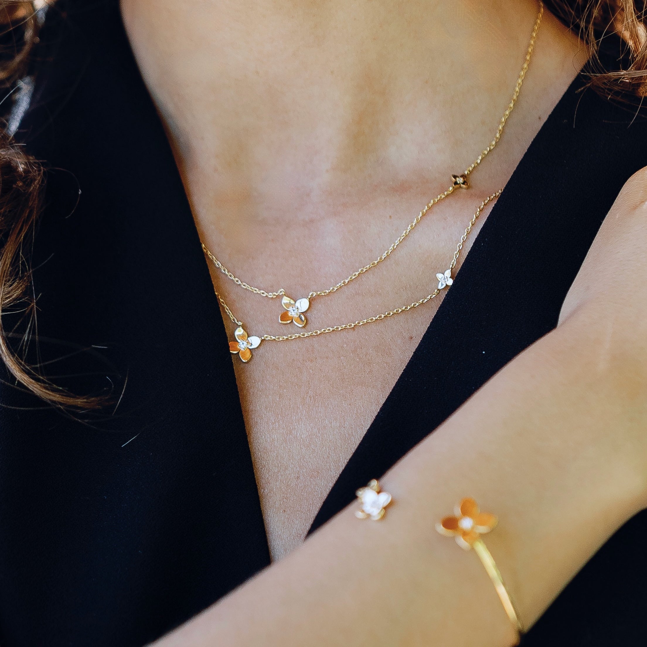 Bloom hydrangea necklace in gold vermeil worn layered on neck