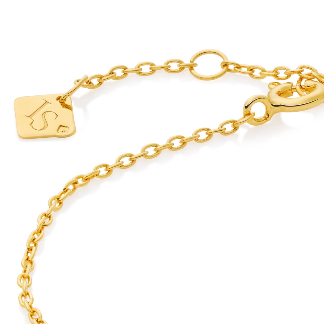 Gold vermeil bracelet with a Ines Santos logo on a white background