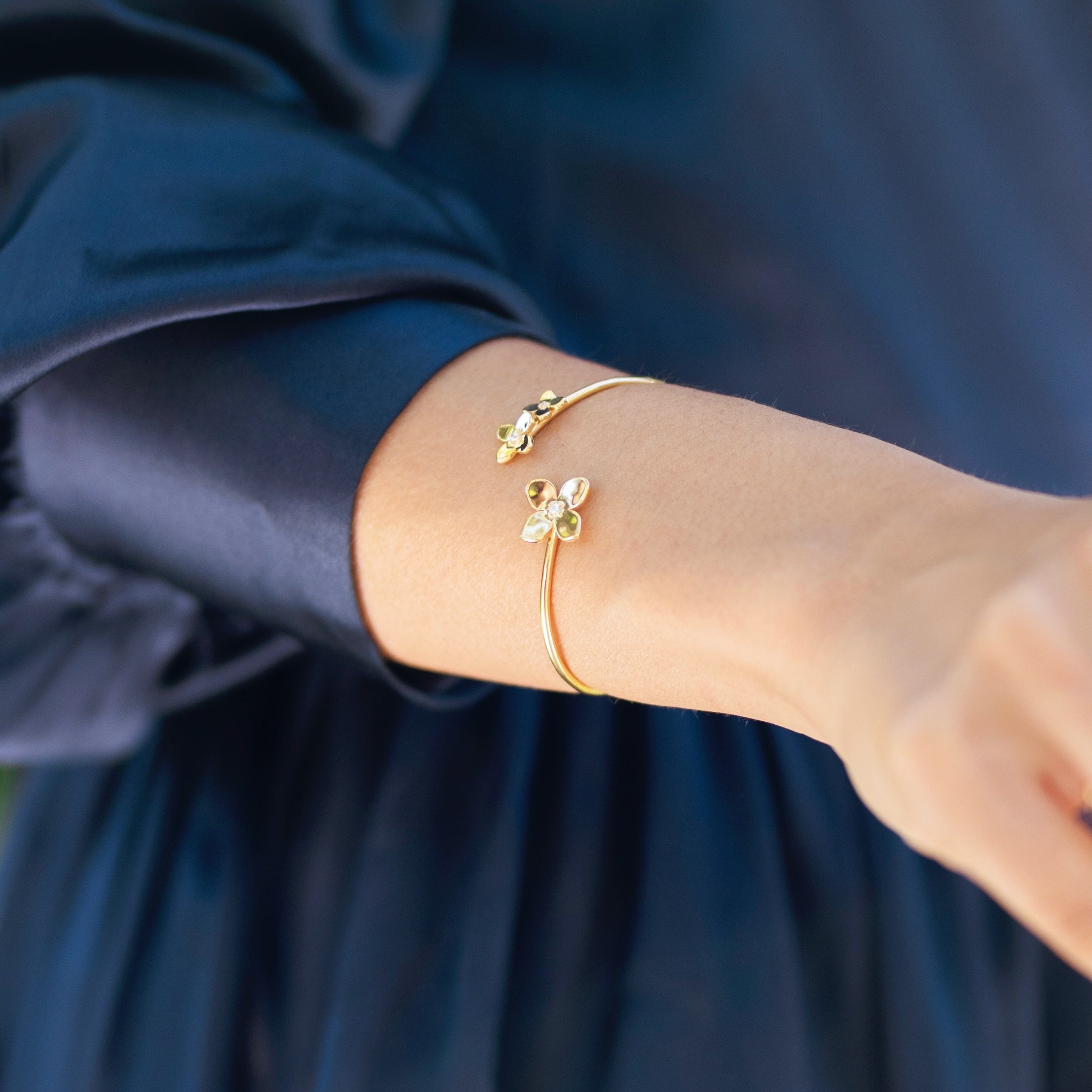 Close-up of Bloom cuff worn displaying detailed hydrangea petal arrangement
