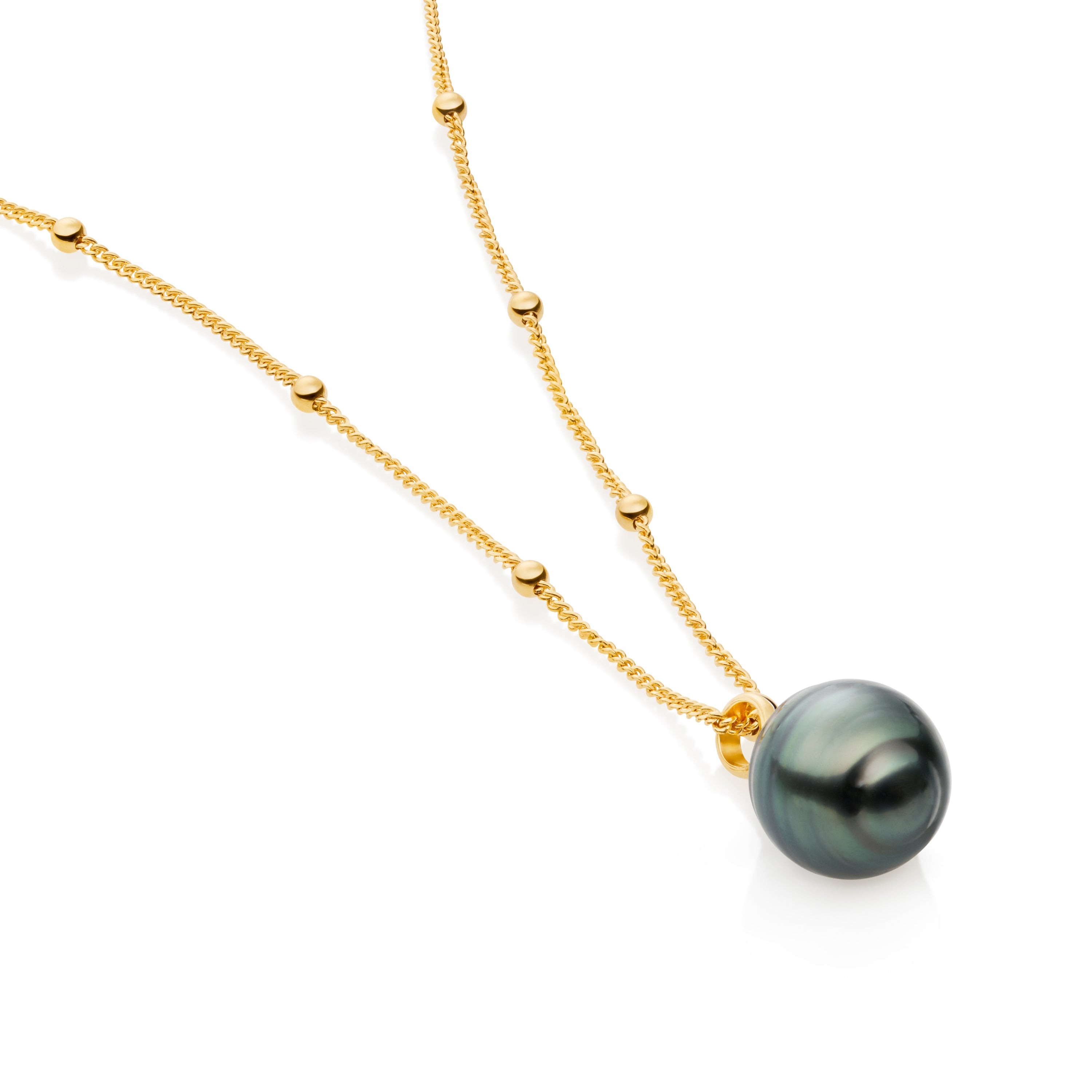 Close-up of Tahitian pearl necklace showing dark lustrous pearl and gold detail