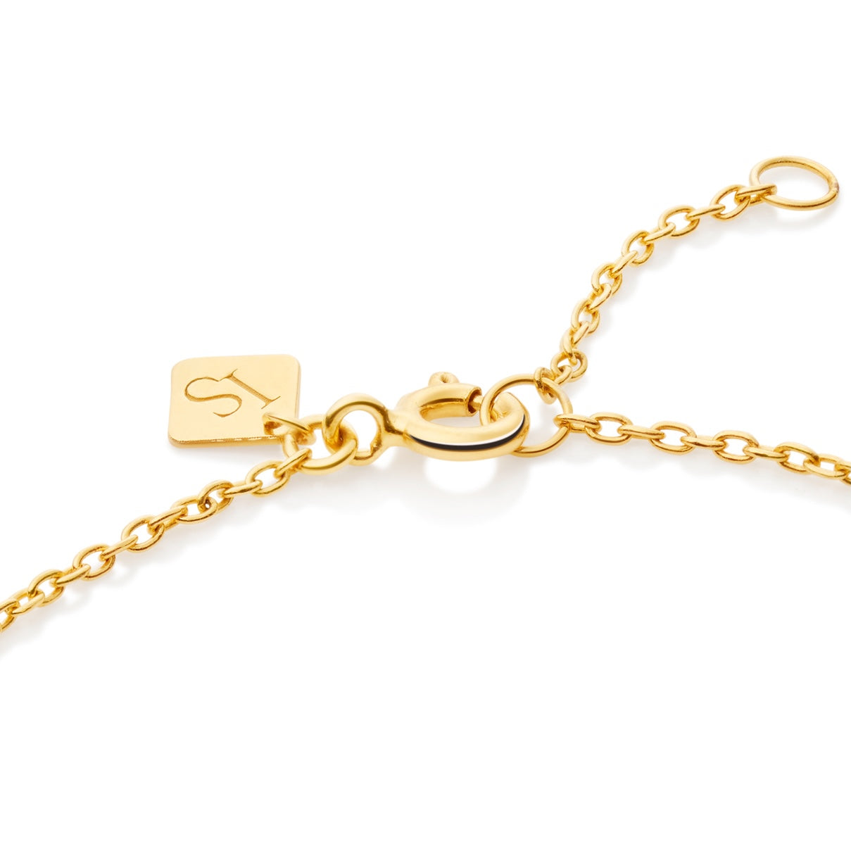 Heart silhouette bracelet in gold vermeil worn on wrist showing delicate heart pendant