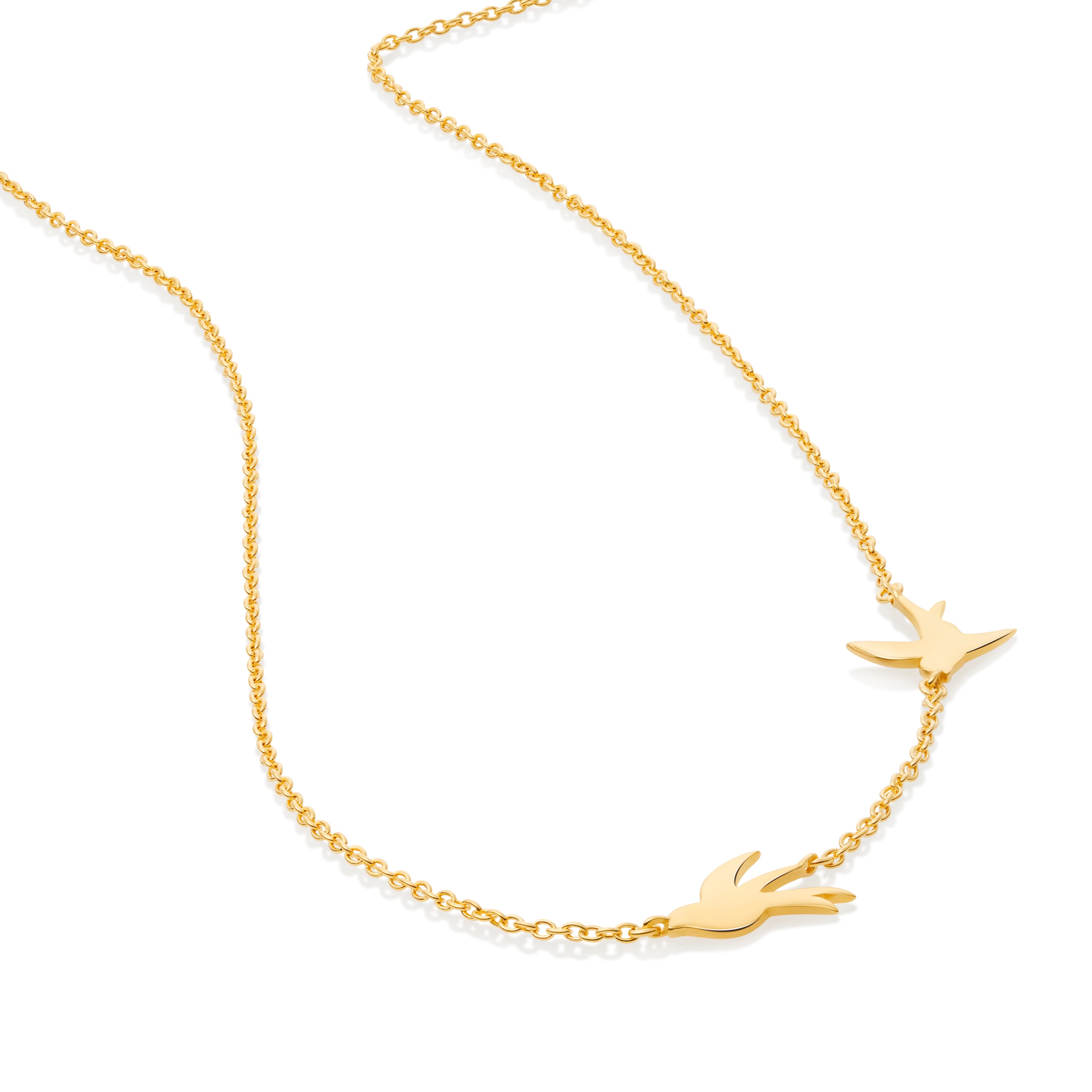 Close-up of swallow necklace showing detailed bird design and wing texture