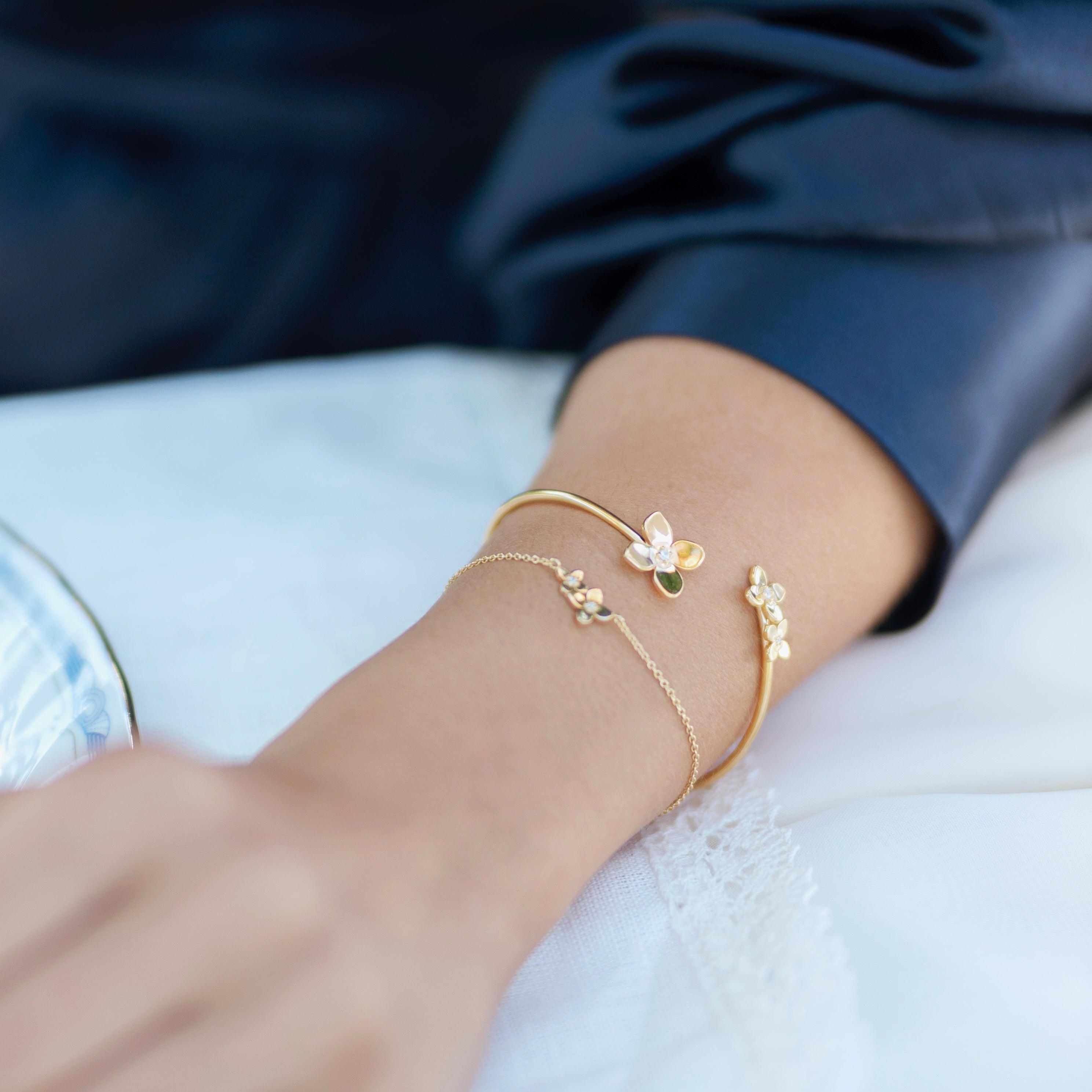 Bloom collection cuff styled showing large petal design with white topaz sparkle