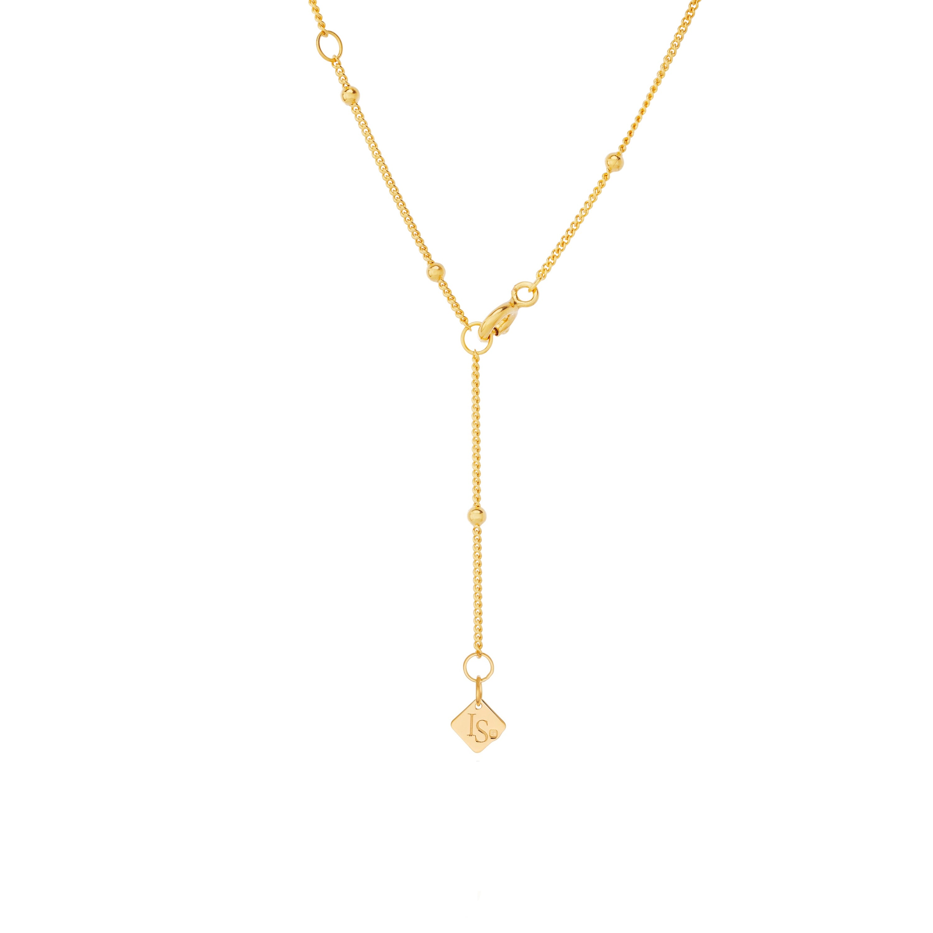 Close-up of baroque pearl necklace showing Inês Santos logo and clasp detail