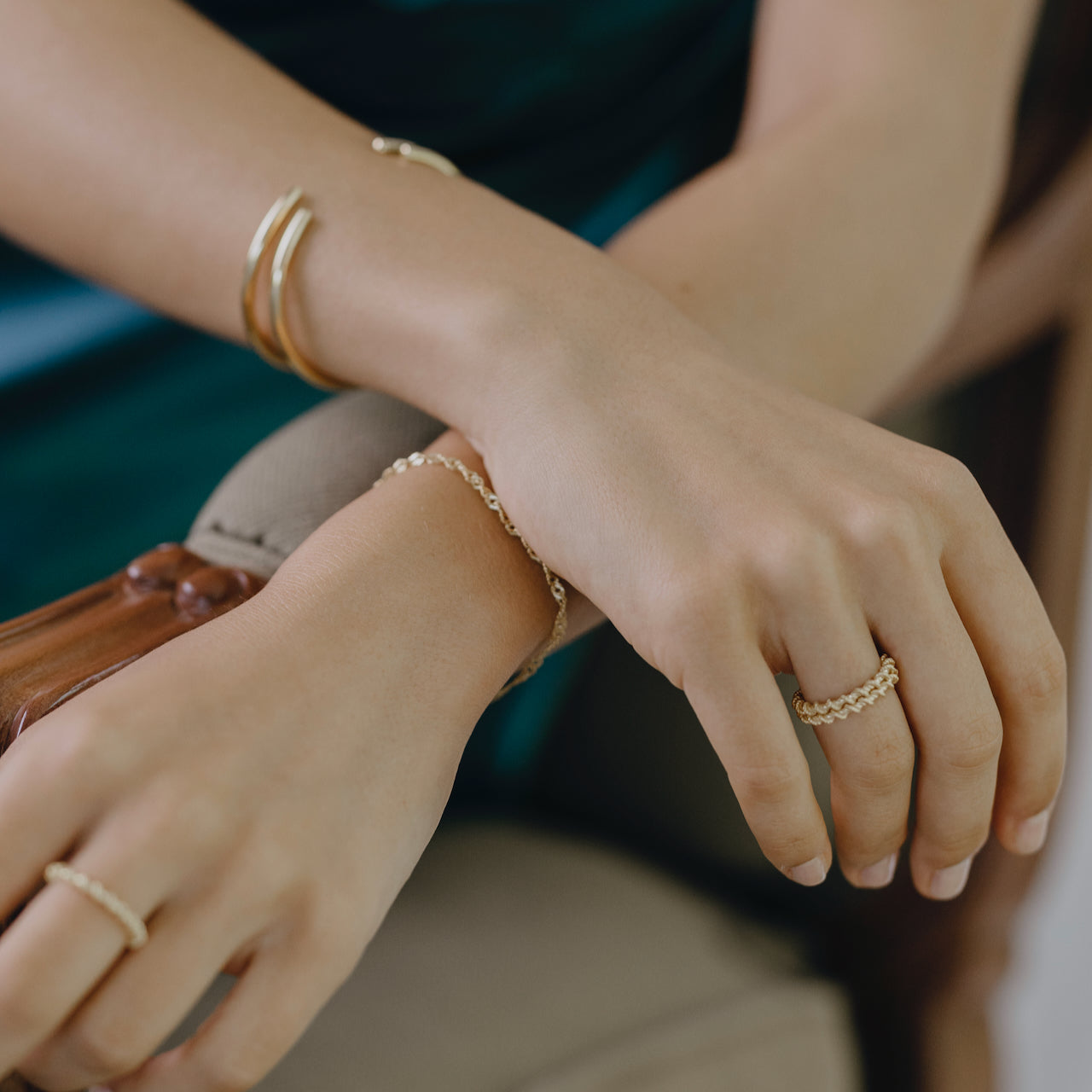 Close-up of Sleek twist ring displaying minimalist curved design on hand