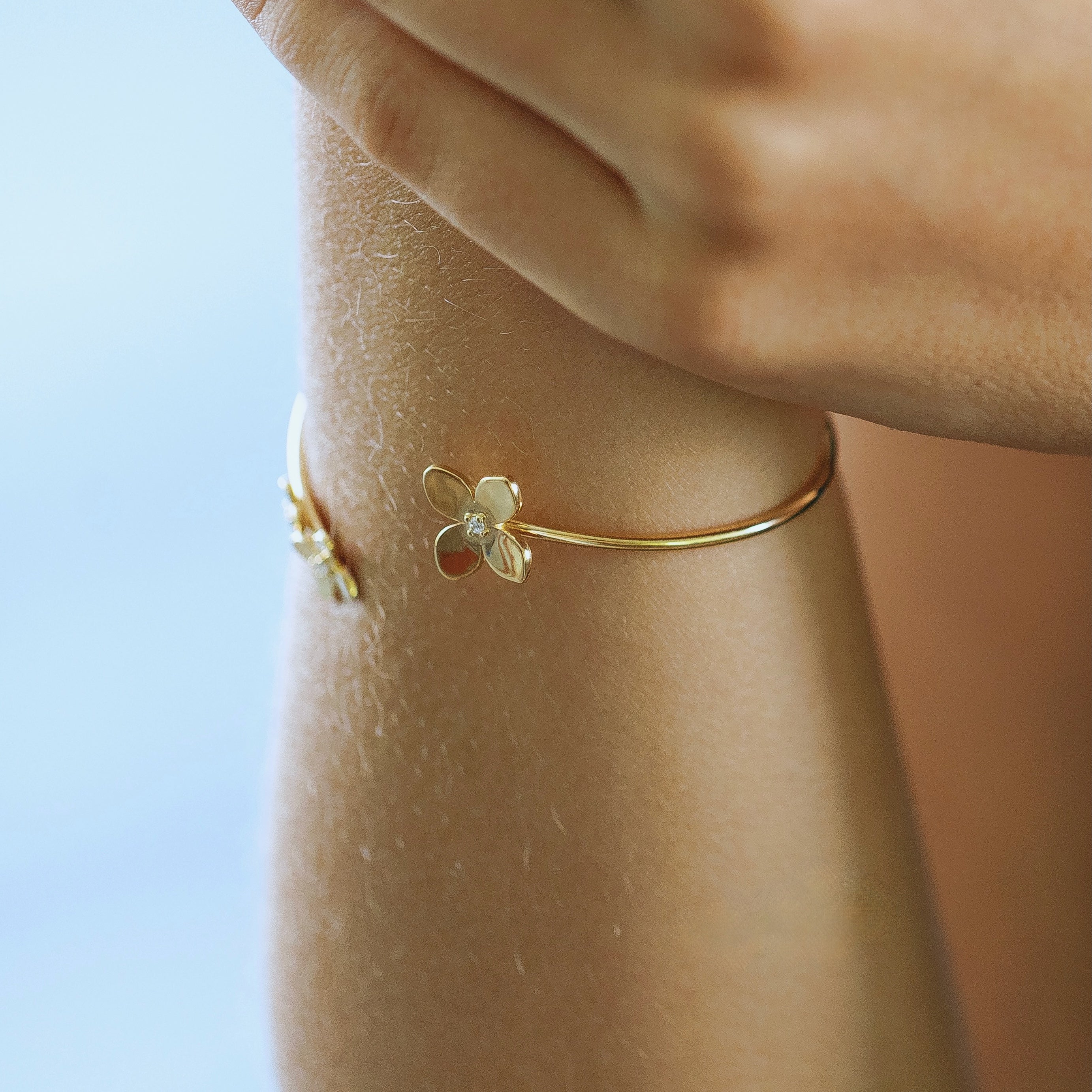 Bloom hydrangea cuff bracelet in gold vermeil worn on wrist