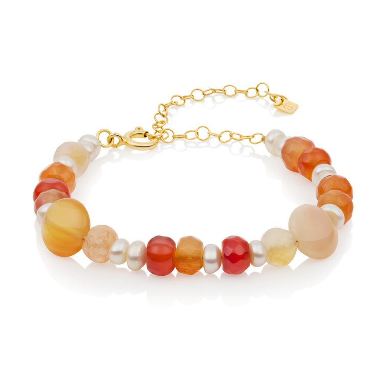 Beaded bracelet with gold chain on a white background