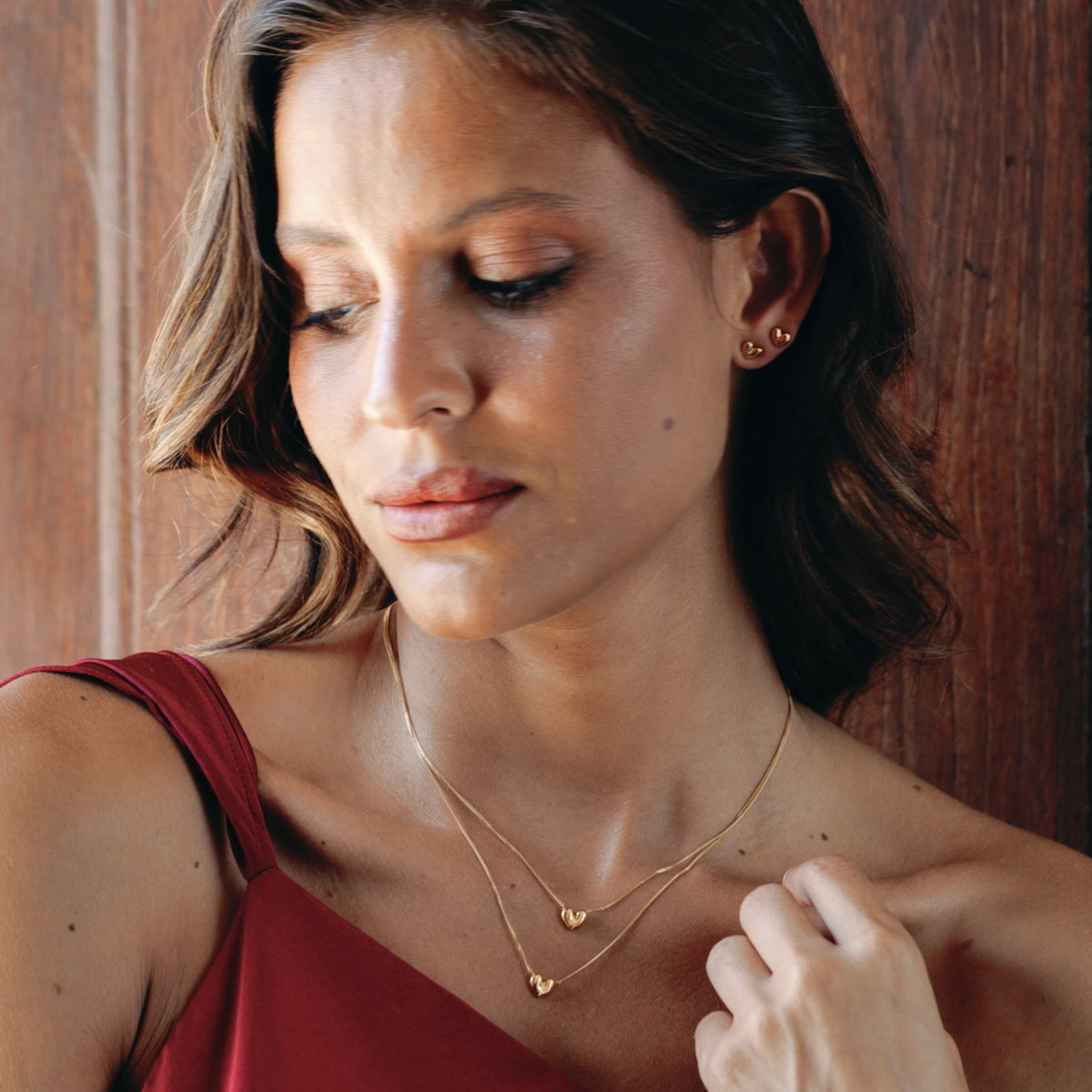 Velvet Heart Studs worn on ear, 18K gold vermeil heart stud earrings, Amore collection, Inês Santos Jewellery