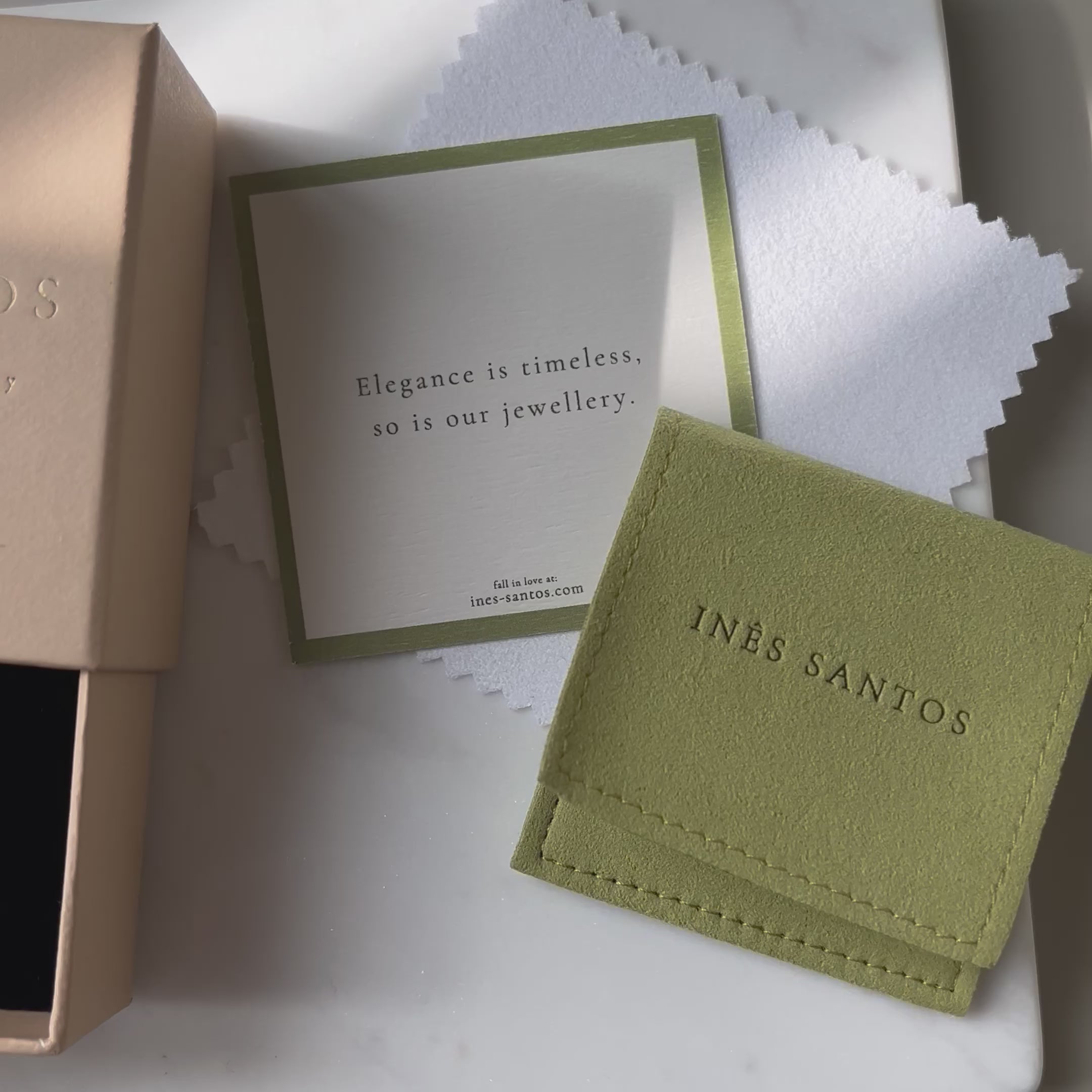 Video of blue topaz pearl earrings in Ines Santos jewellery packaging